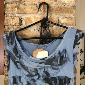 Boutique Italian-made sleeve-less layer dress.